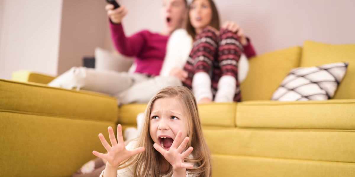 Child and parents are scared watching television