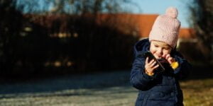 Small child works with a Xiaomi phone that has parental controls