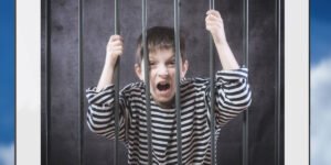 A child screams behind bars in a tablet protected by parental controls