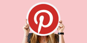 Woman showing a pinterest icon