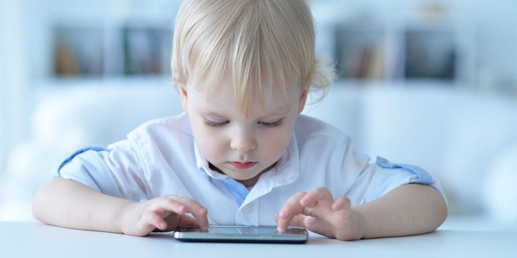 Boy playing with smartphone