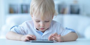 Boy playing with smartphone