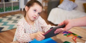 Parent taking away the tablet from child
