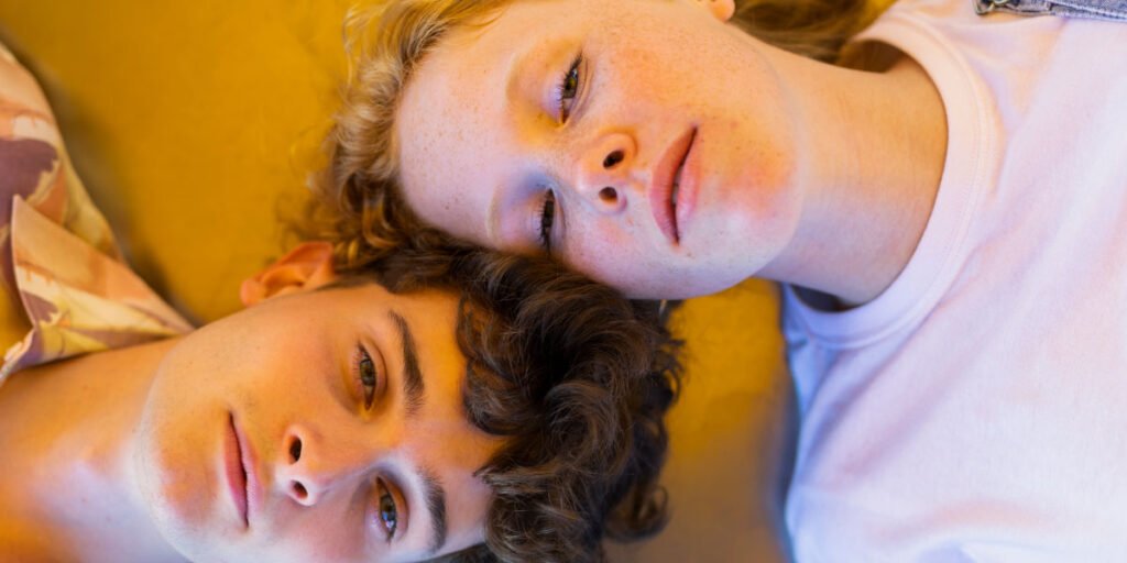 Boy and girl lying on the floor