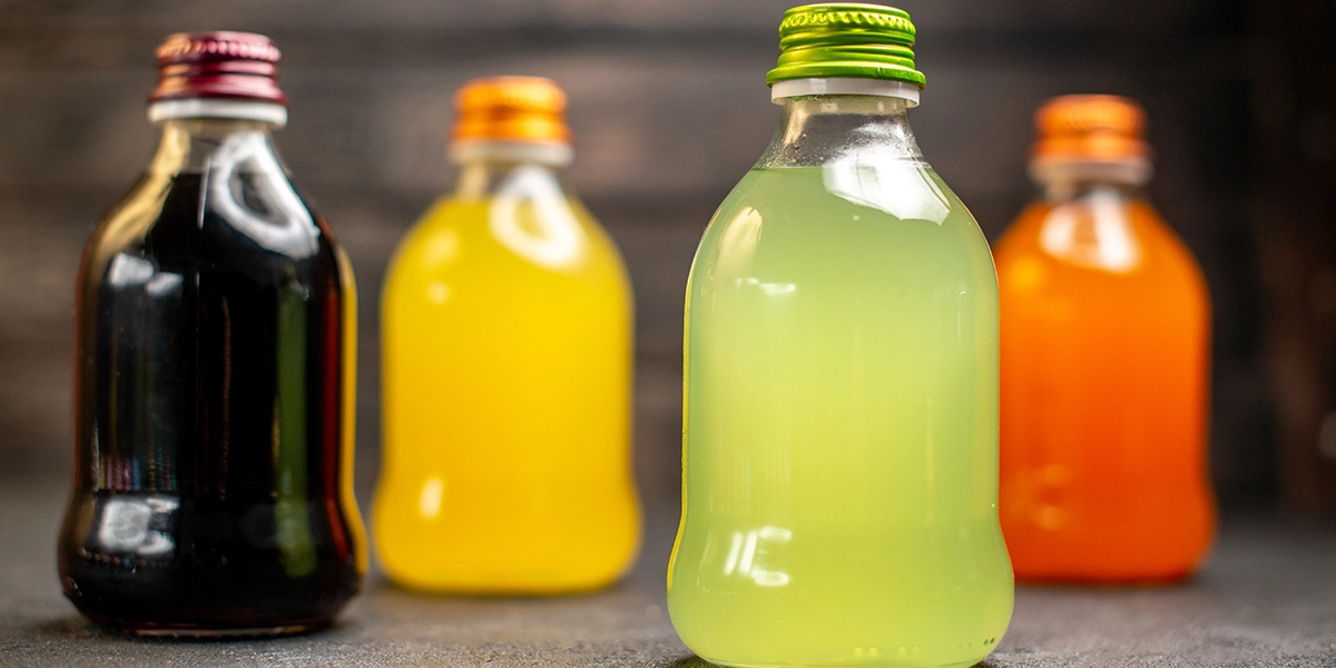 four bottles of artificially sweetened drinks with different colors