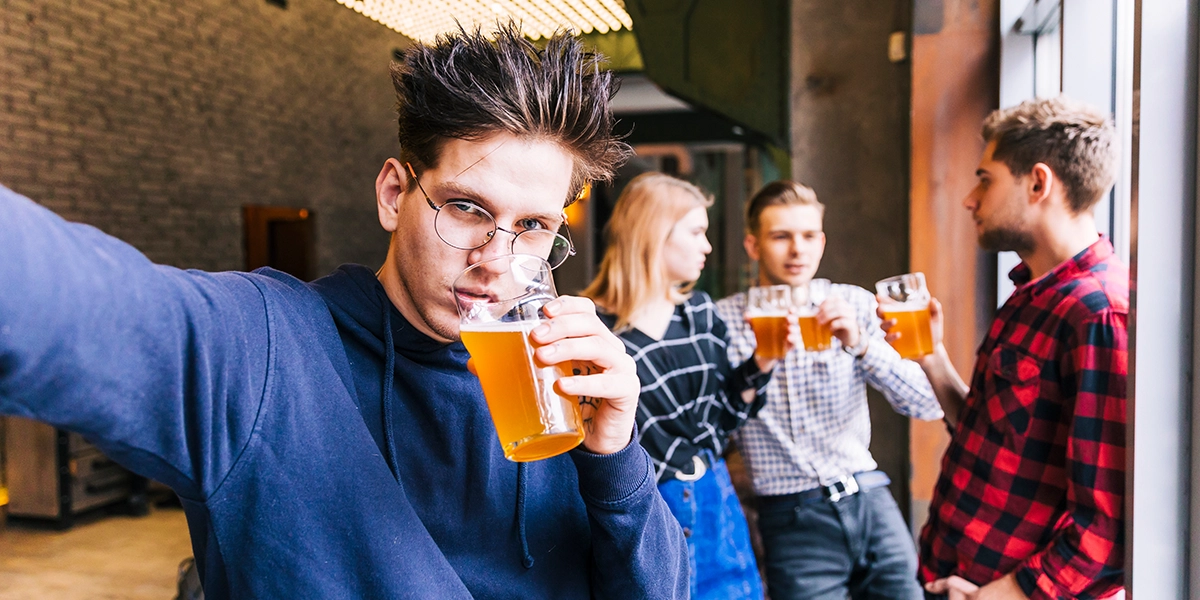 Selfie of teens drinking beer