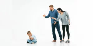 Angry parents scolding their son