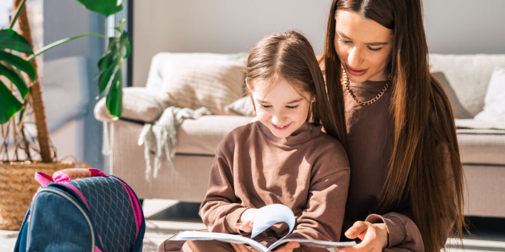 Mother and daughter reading book