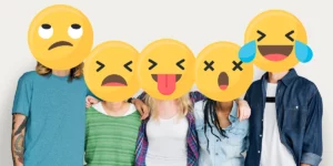 Teens with emojis on their faces representing different emotions