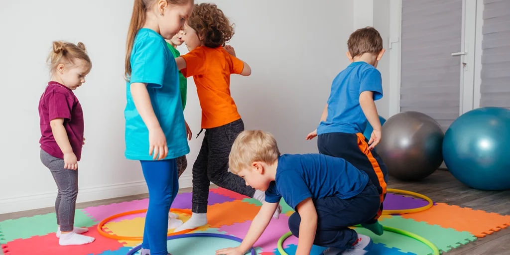 Children doing bodily kinesthetic activities at the gym