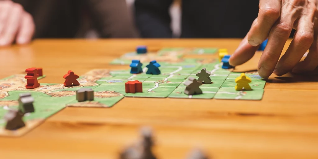 Carcassonne board game played on a table