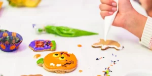 Child decorating cookies and making food crafts