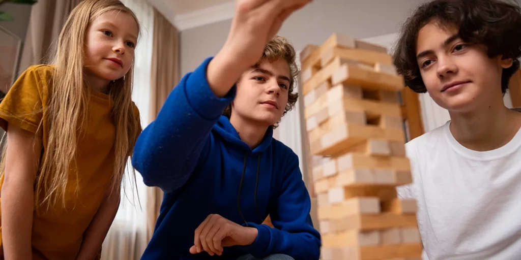 three pairs of hands making a puzzle