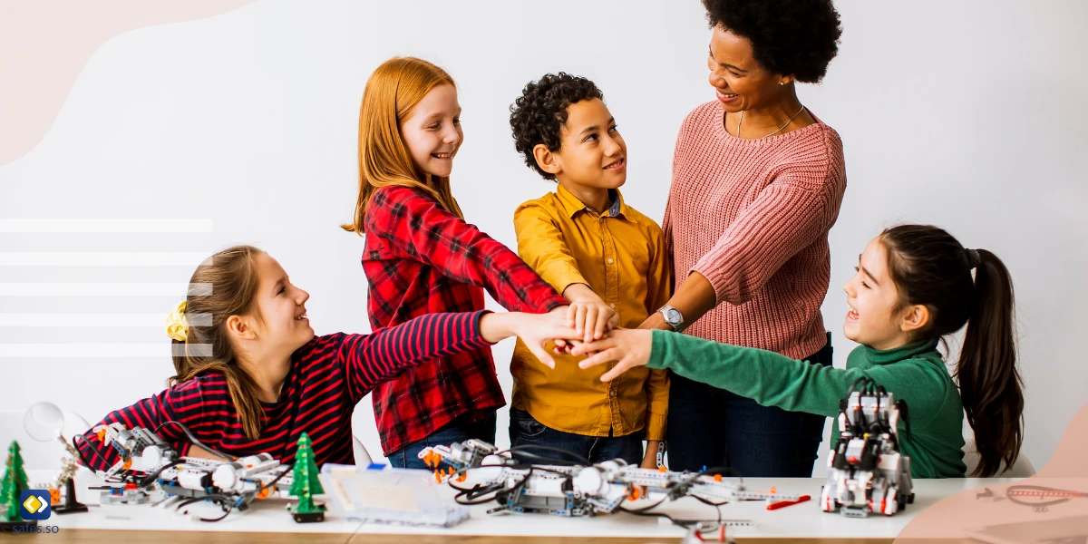 Teacher helping children develop social skills by playing a collaborative game