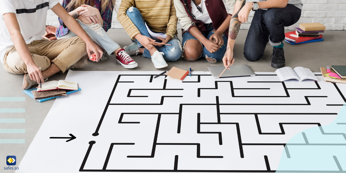 students solving a maze on paper