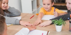 kids playing and socializing around a table
