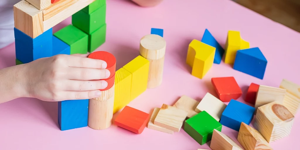 Child playing with building blocks