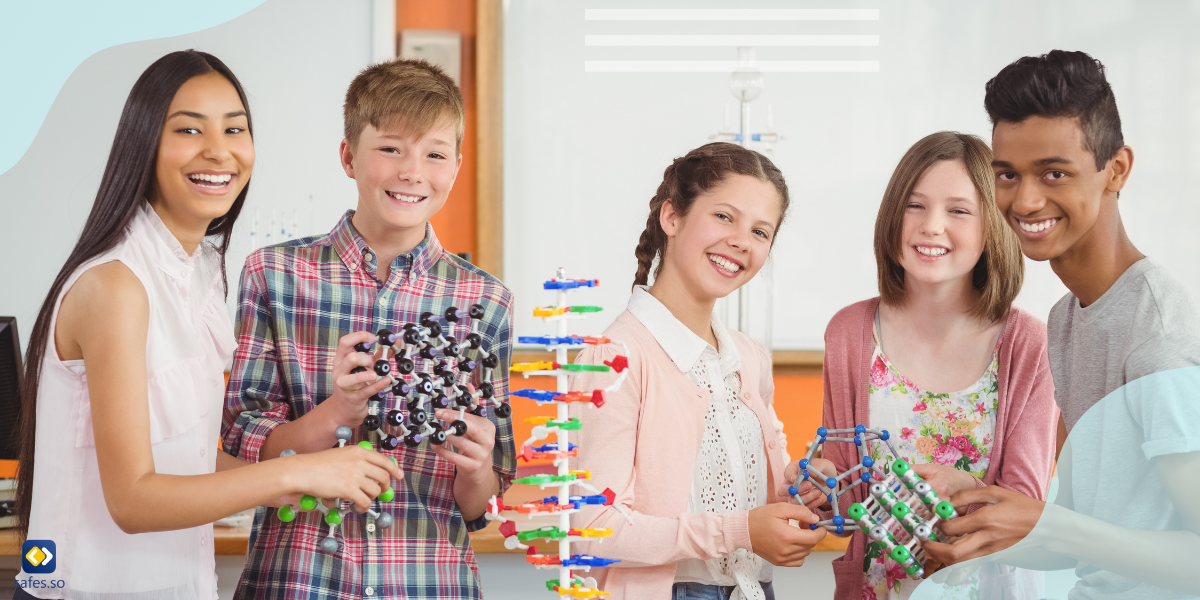 students holding multiple scientific prototypes