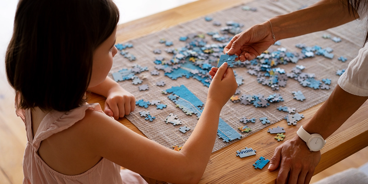 little girl making puzzle