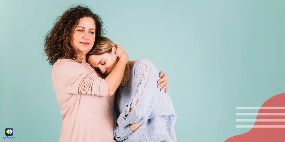 Mutter umarmt ihre Tochter, die nicht umarmt werden will