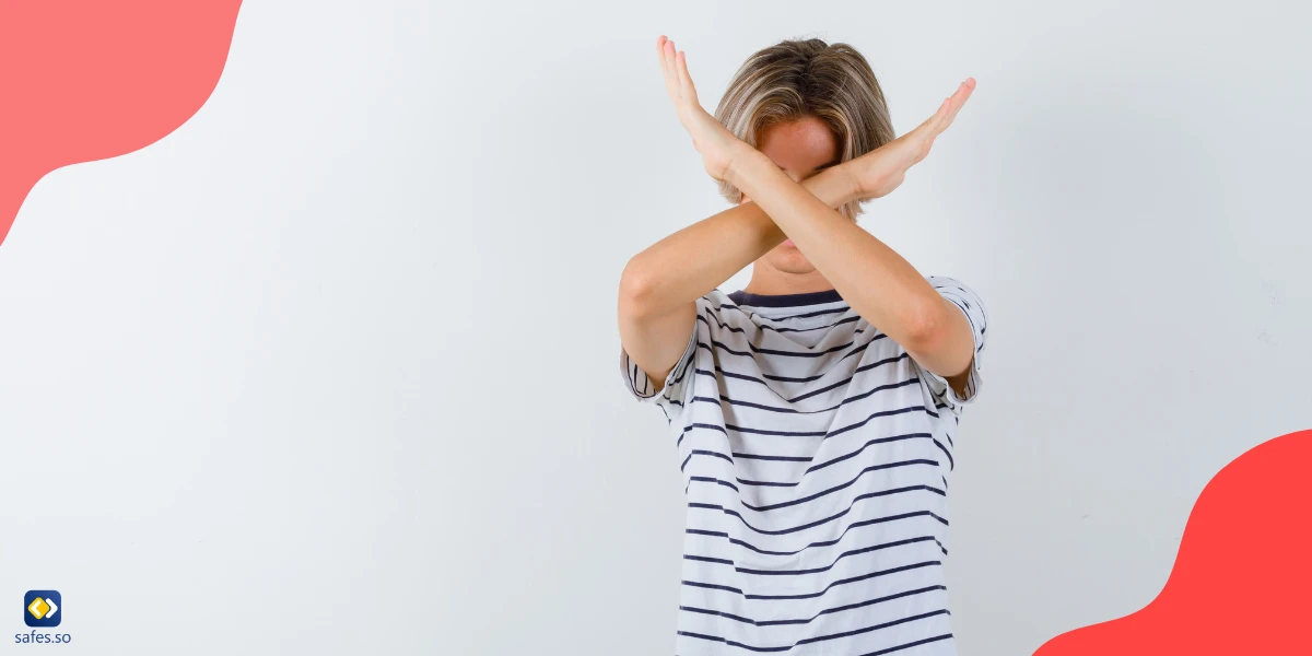 boy with arms crossed and saying no