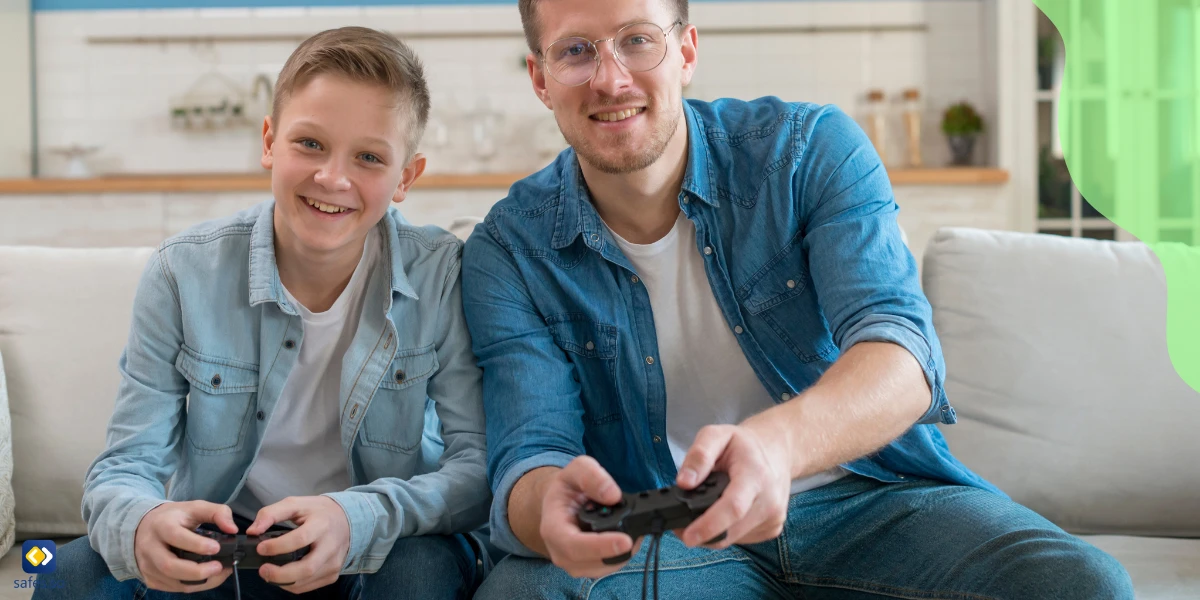 Happy father and son playing video games together