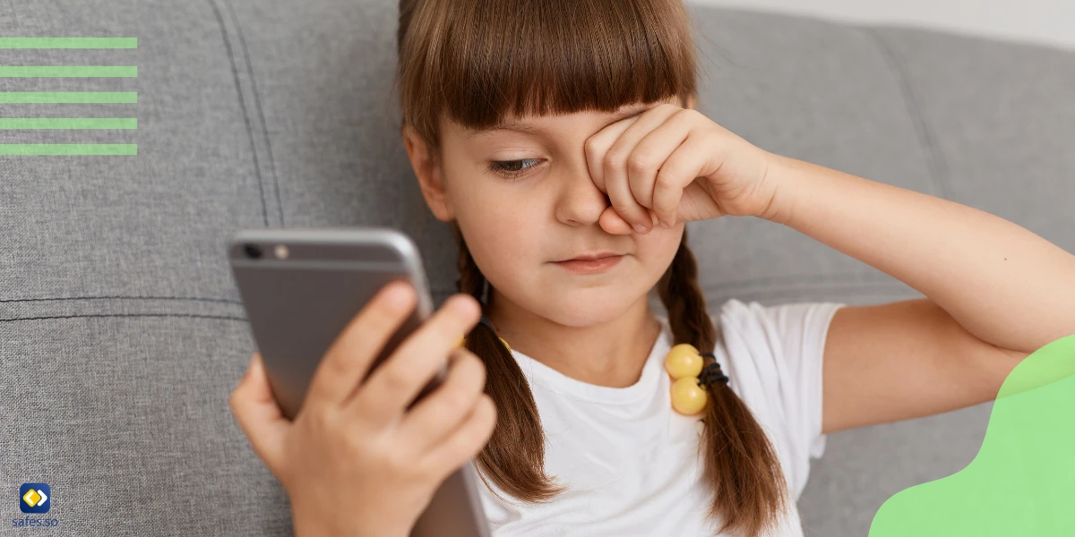 Little girl has eye strain because she has been staring at her phone for a long time