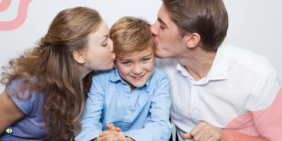 Parents kissing their son because they have a happy and respectful relationship