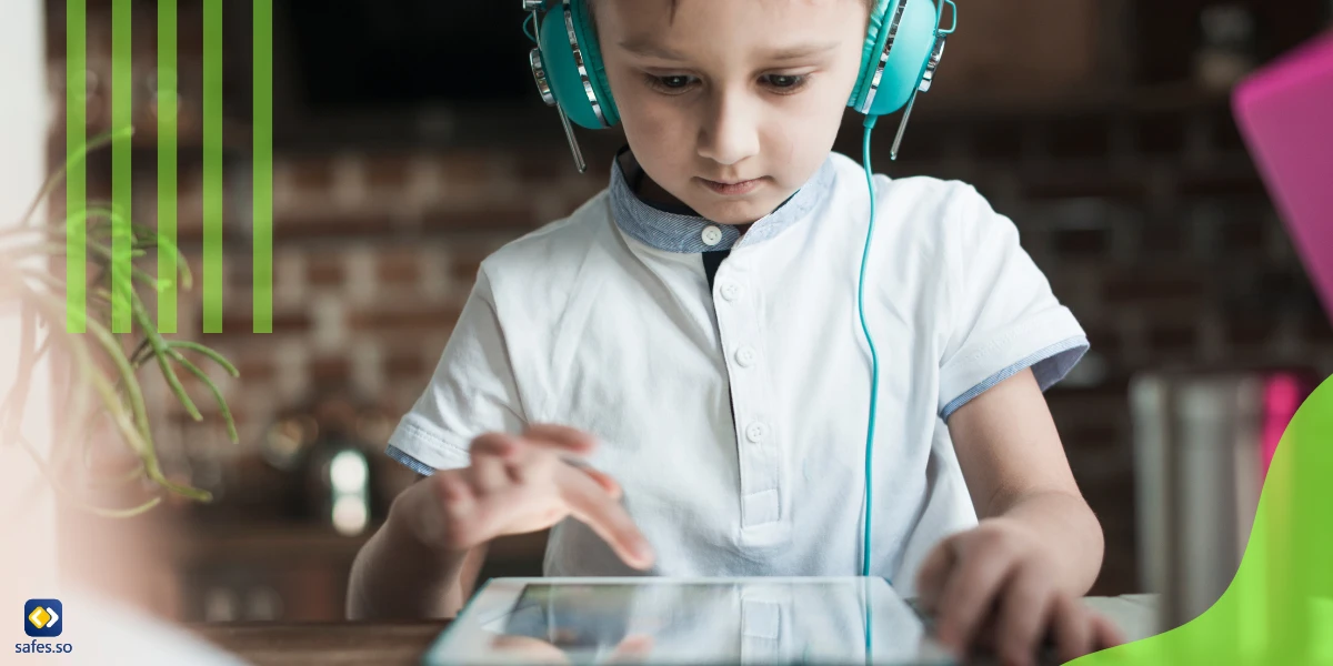 child with earphones using an ipad