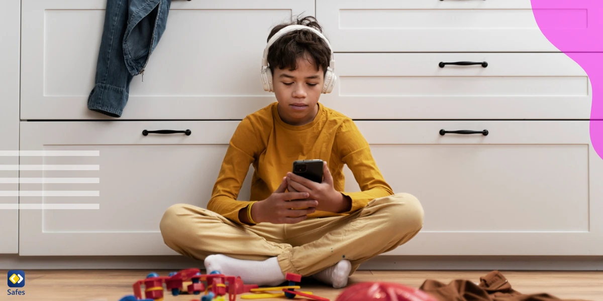Child using technology while surrounded with toys