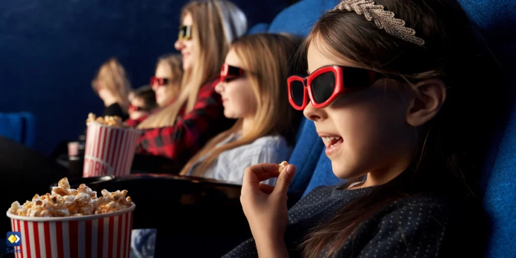 Happy kids watching tudum 2023 trailers