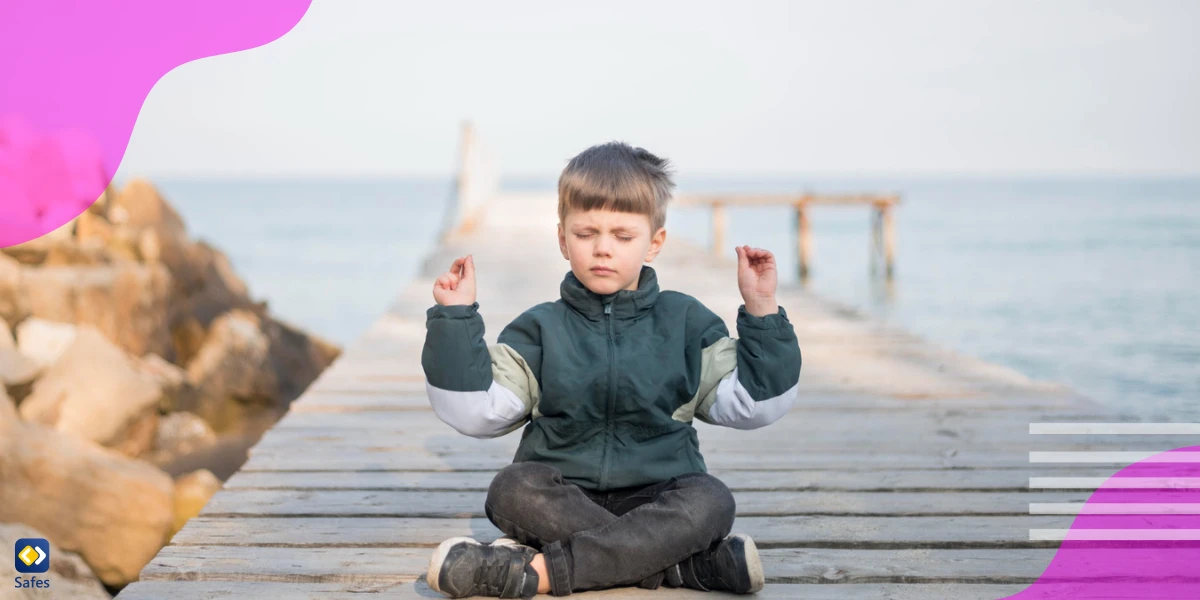 child practicing mindfulness on a deck at the water