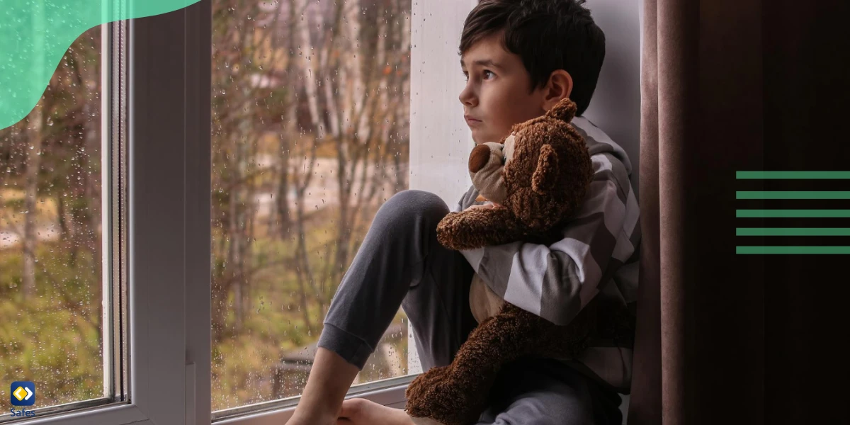 Lonely kid hugging his doll