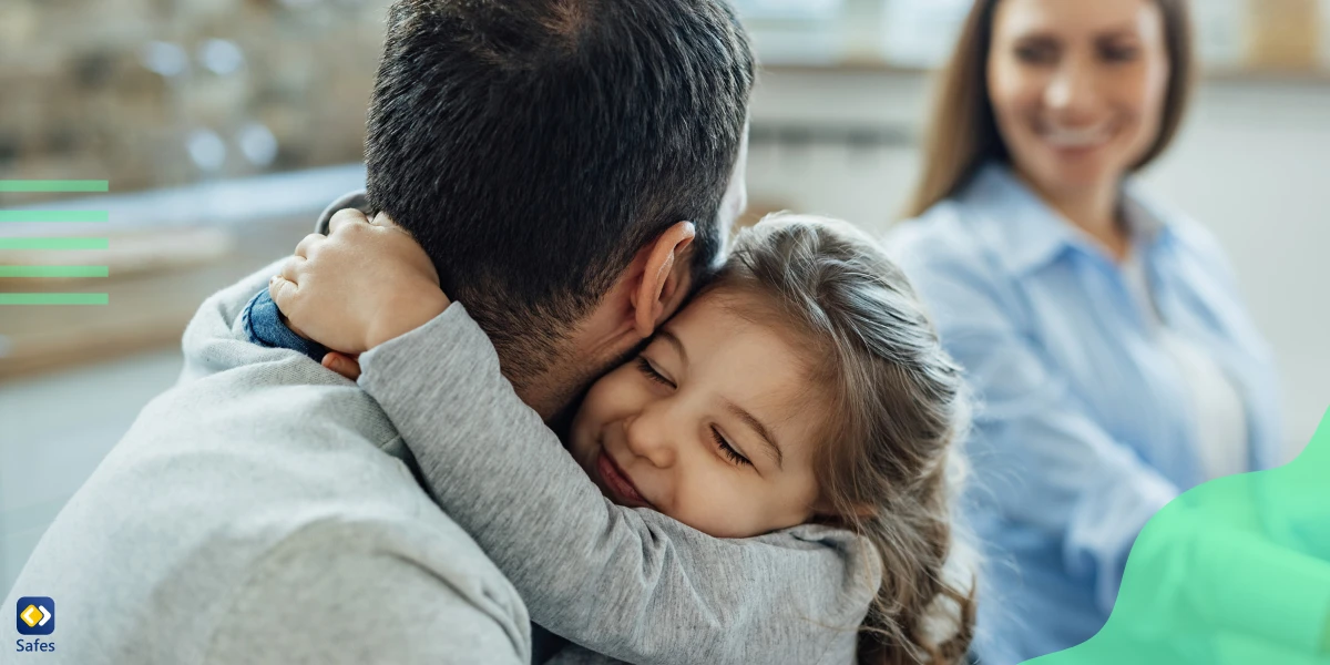 Child hugging her father because he and his wife have created a safe and harmonious space for her