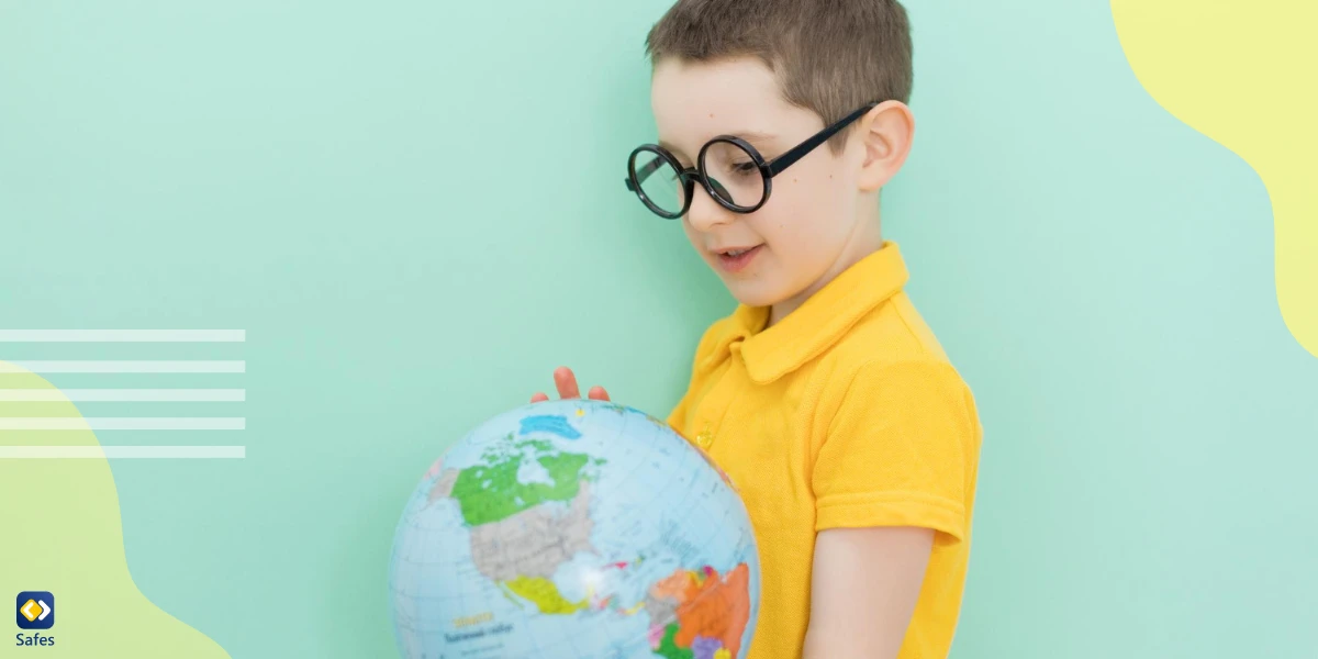 A child holds a world globe