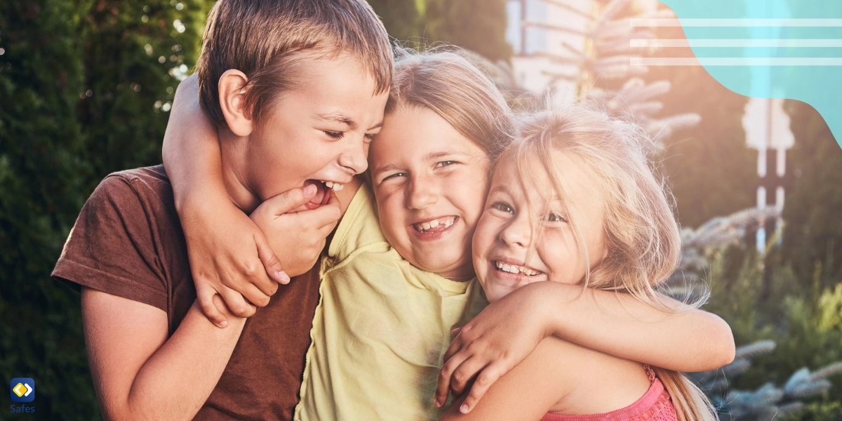 Siblings hugging each other and laughing