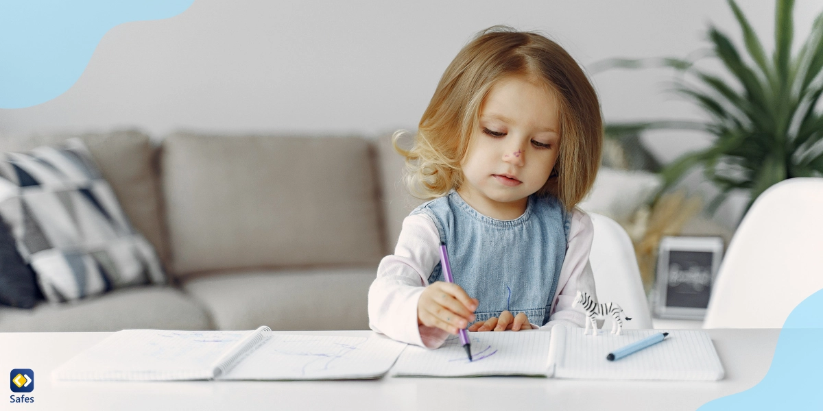 Little girl trying to write