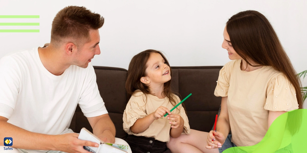 a baby girl is talking with her parents