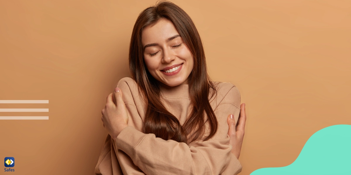 Girl hugging herself and smiling