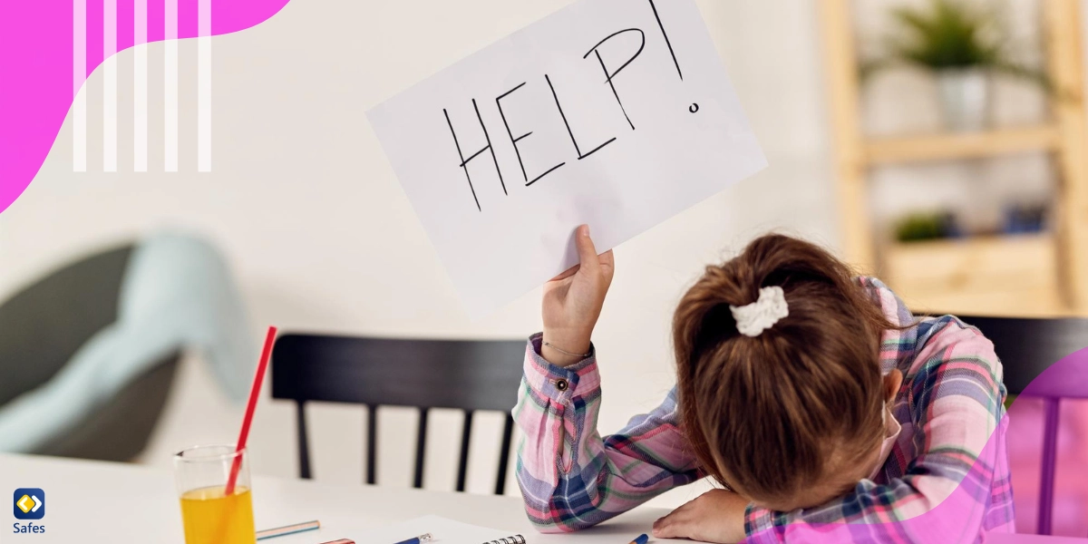 Frustrated child showing a HELP sign while studying