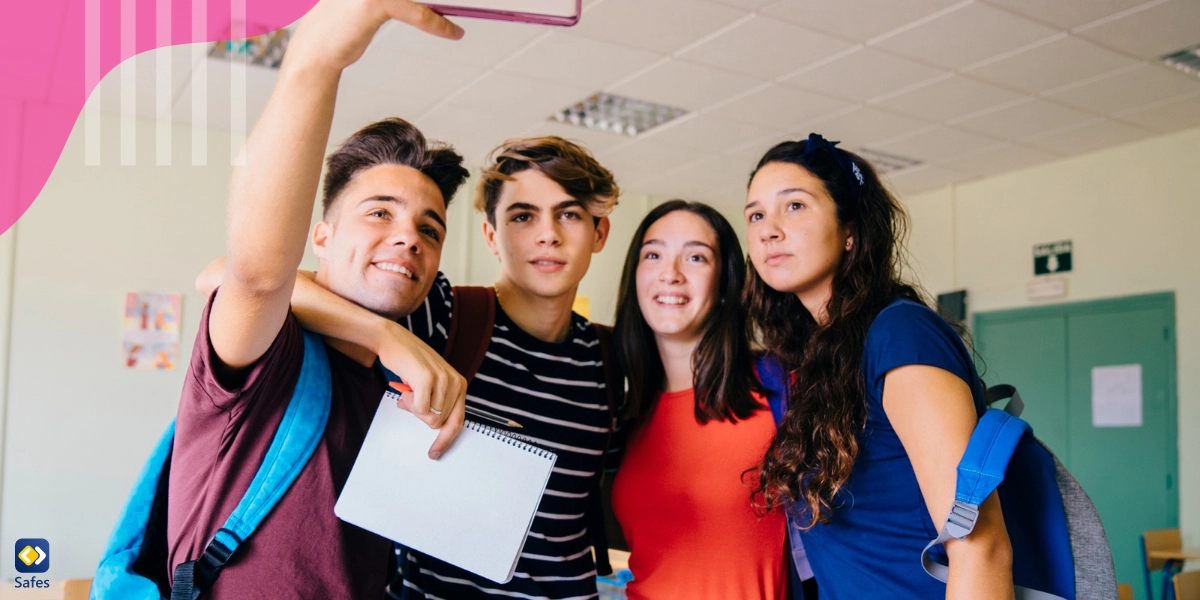 Group of teen students taking a selfie in class