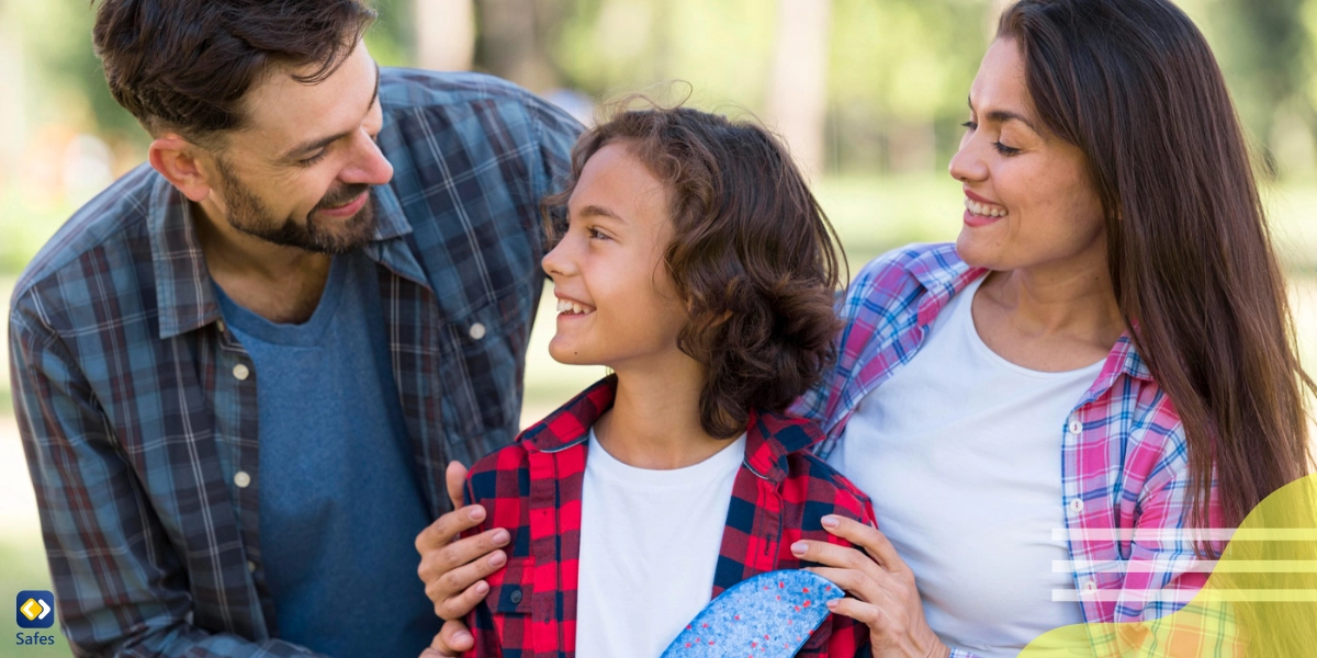 Happy parents and a child are in a park