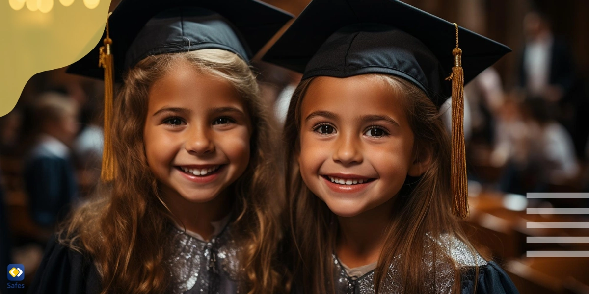 Two graduating preschooler girls wearing graduation caps and gowns at a preschool graduation party