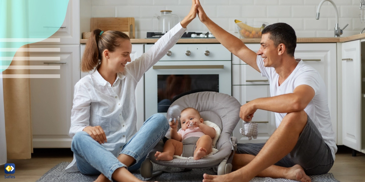 Mother and father giving each other a high five while looking at their child in the crib because they feel no parental guilt