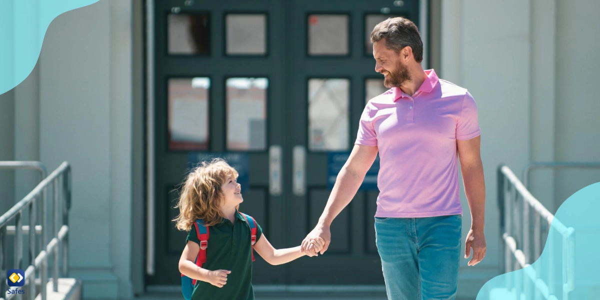 A father is taking his son to school.