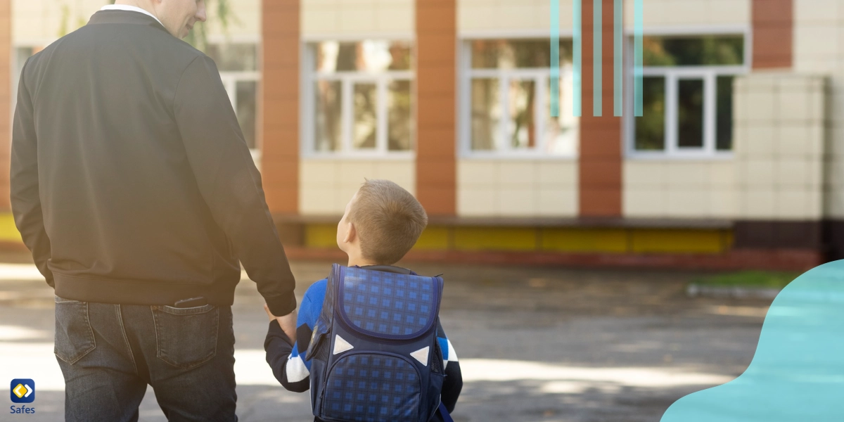 A father is attending a parent-teacher meeting with his son.