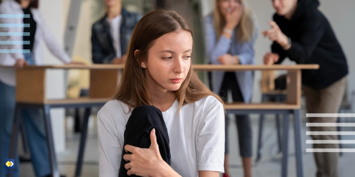 Some students in the background making fun of a girl in the front