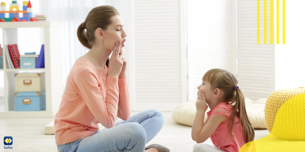 A mother is calmly talking to her daughter about the adverse effects of nail-biting on her health.