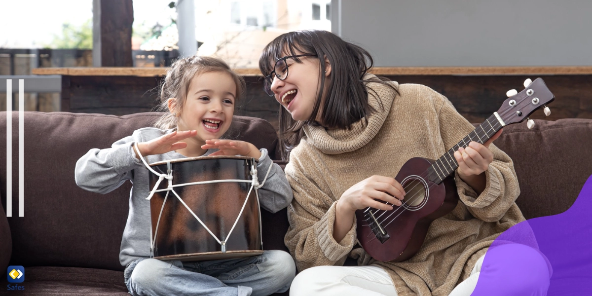 Parent and child playing ukelele and drums