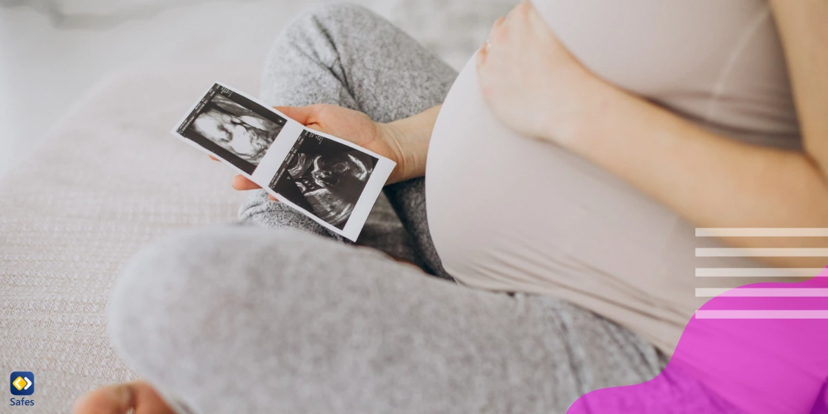 A pregnant mother looking at her sonogram.